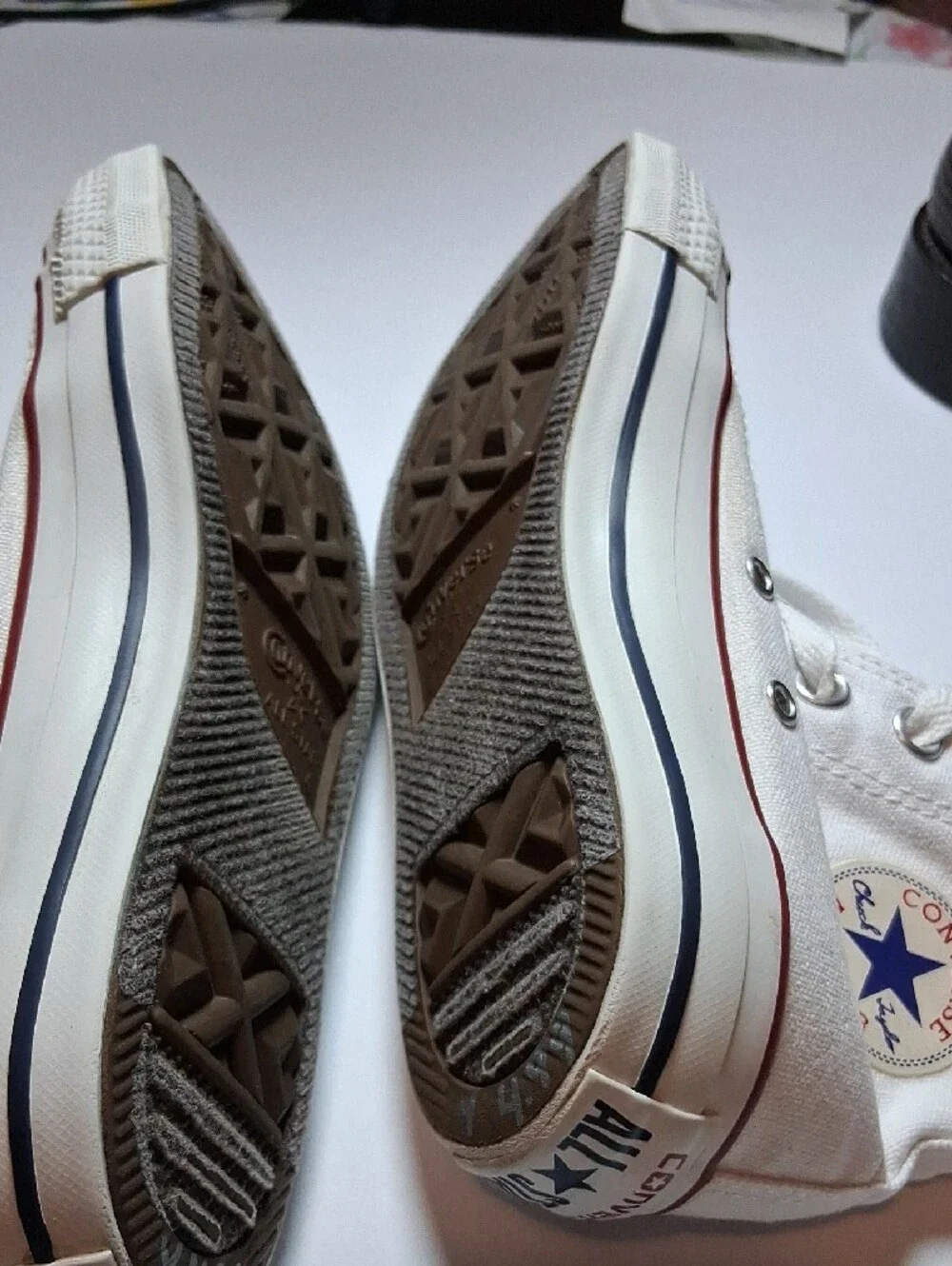 Converse white high-top sneakers with red trim